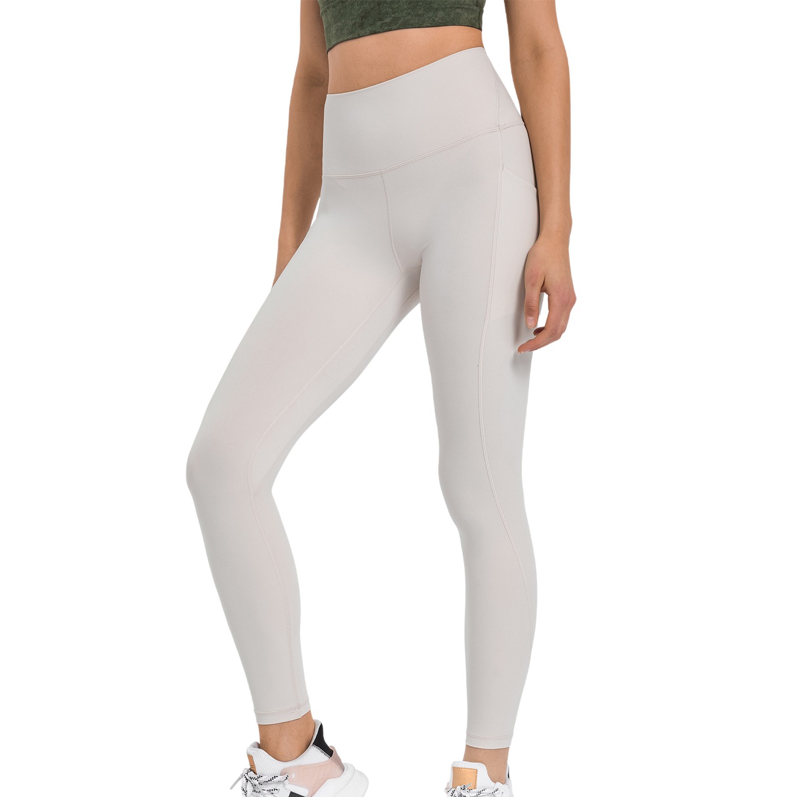 Pantalones de yoga de alto rendimiento con bolsillos laterales: leggings deportivos, nailon y spandex, ajuste ceñido y sujeción.